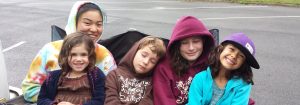Happy sleepy campers, counselor, and youth leader after swim day at Tilden Outdoor Camp in Berkeley