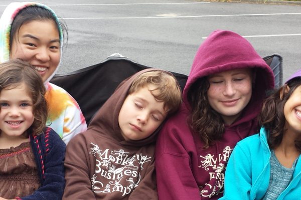 Happy sleepy campers, counselor, and youth leader after swim day at Tilden Outdoor Camp in Berkeley
